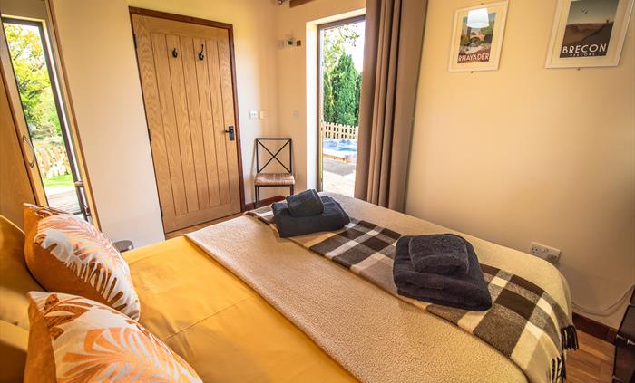 Ash and Sycamore Lodge double bedroom with access out to veranda